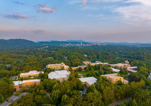 University campus buildings in a mountain landscape